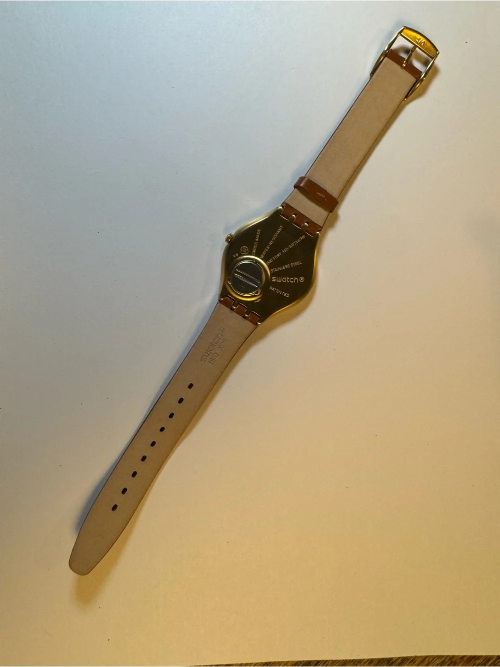 Swatch Skinsand SYXG104 gold-tone and leather analog watch